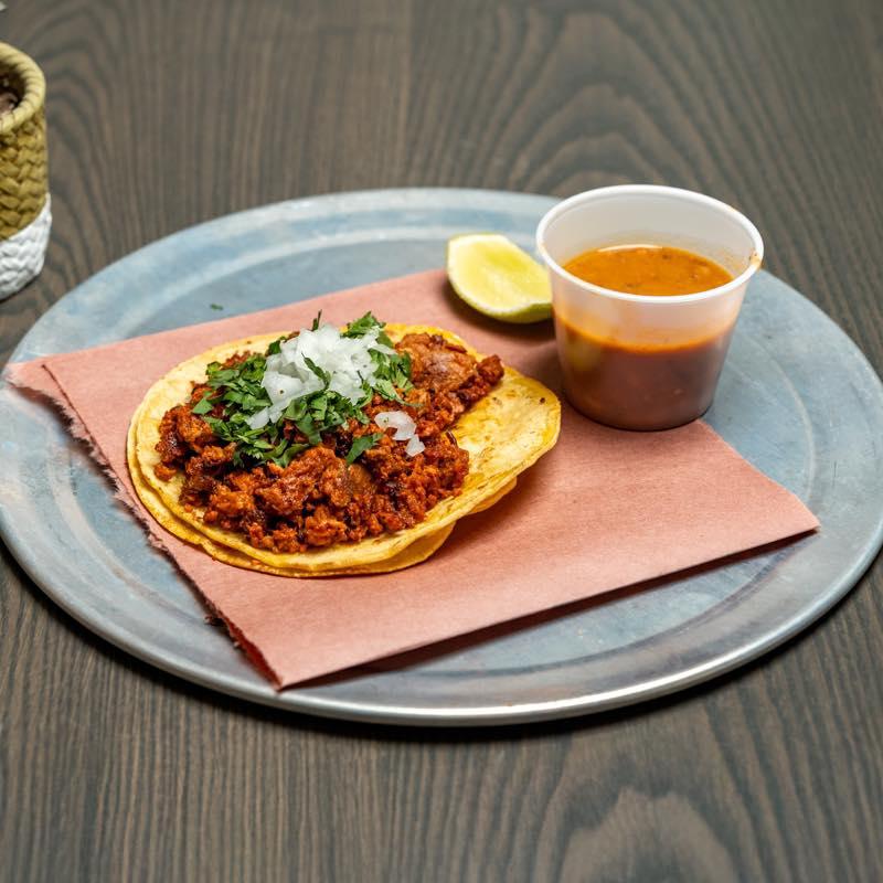 Mexico City-style taco with chorizo, onions and cilantro on a corn tortilla served with salsa at La Taqueria by Katsuji in Boxyard RTP.